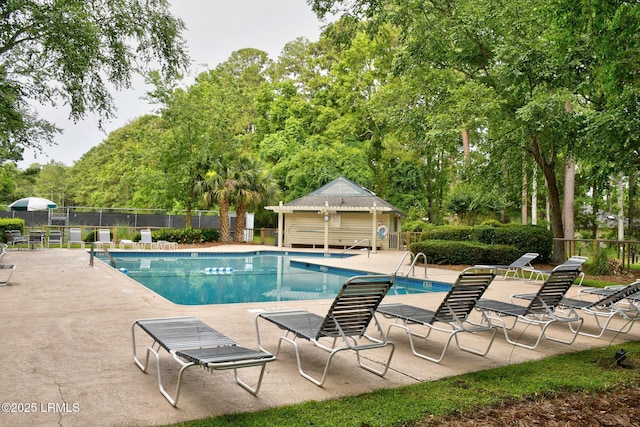 9 Spartina Cres, Bluffton, SC 29910 - community pool featuring a patio and view of wooded area
