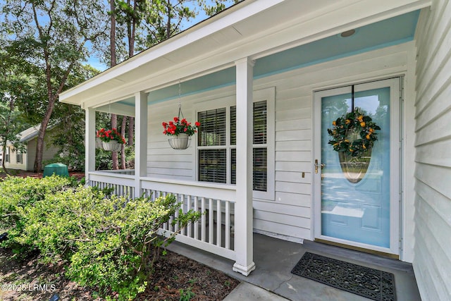 entrance to property featuring a porch