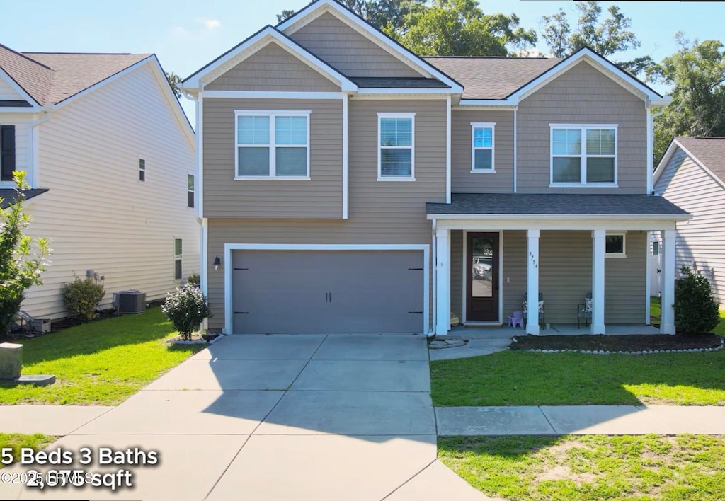 3754 Oyster Bluff Dr, Beaufort, SC 29907 - view of front of home with covered porch, a front lawn, concrete driveway, a garage, and roof with shingles