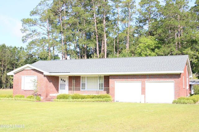 1933 Bamberg Hwy, Hampton, SC 29924 - view of front of property featuring an attached garage, a front lawn, and brick siding