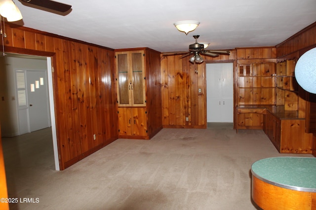 1933 Bamberg Hwy, Hampton, SC 29924 - spare room featuring ceiling fan, wooden walls, and light colored carpet