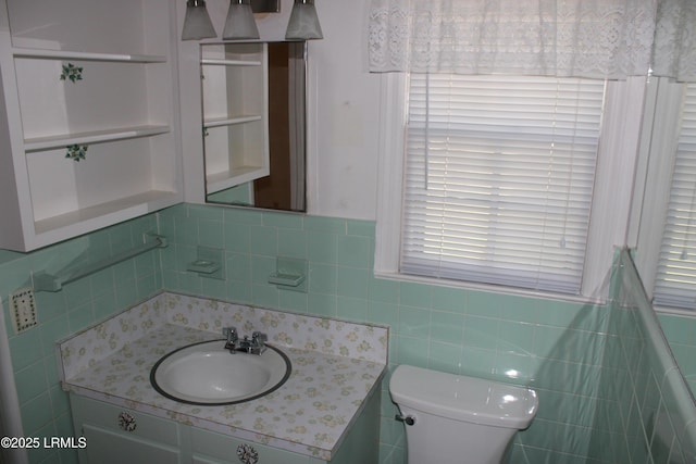 1933 Bamberg Hwy, Hampton, SC 29924 - bathroom with vanity, tile walls, toilet, and healthy amount of natural light