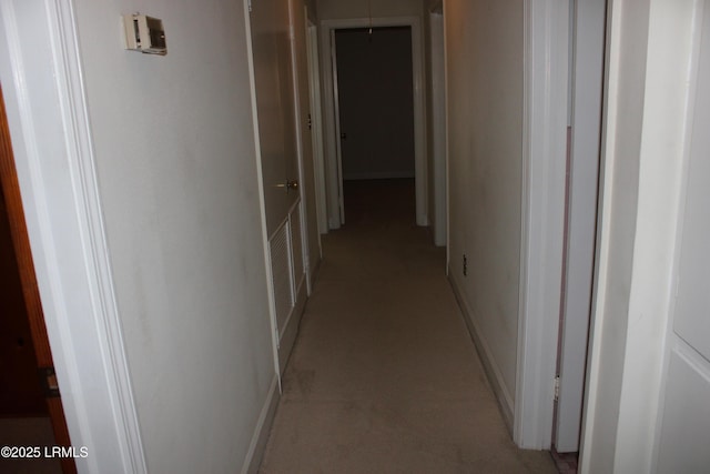 1933 Bamberg Hwy, Hampton, SC 29924 - corridor featuring light carpet, baseboards, and attic access