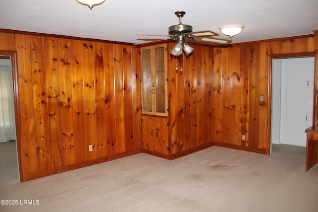 1933 Bamberg Hwy, Hampton, SC 29924 - unfurnished room featuring light colored carpet, a ceiling fan, wooden walls, and baseboards