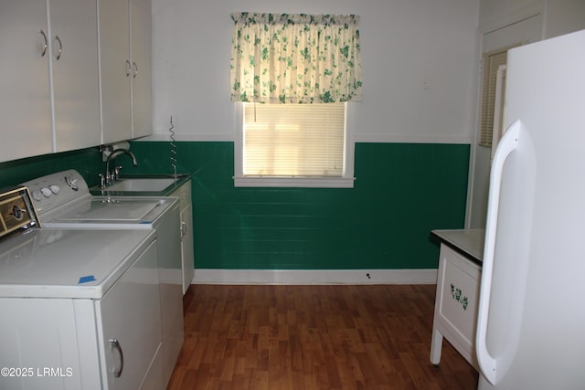 1933 Bamberg Hwy, Hampton, SC 29924 - laundry room featuring washing machine and dryer, cabinet space, and dark wood-style floors