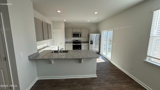 24 Twickenham Loop, Yemassee, SC 29945 - kitchen with gray cabinets, a peninsula, plenty of natural light, stainless steel appliances, and recessed lighting
