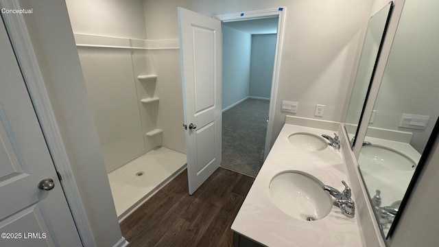 24 Twickenham Loop, Yemassee, SC 29945 - full bathroom featuring wood finished floors, double vanity, and a shower