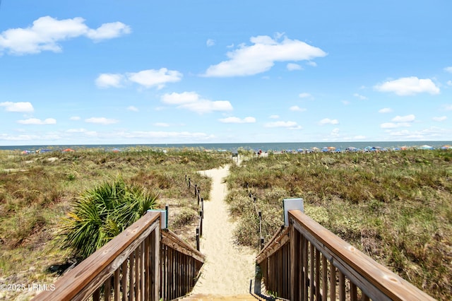 surrounding community featuring a water view