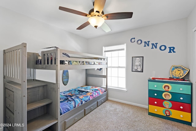 bedroom featuring light carpet and ceiling fan