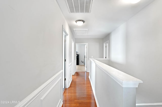 hallway with wood-type flooring