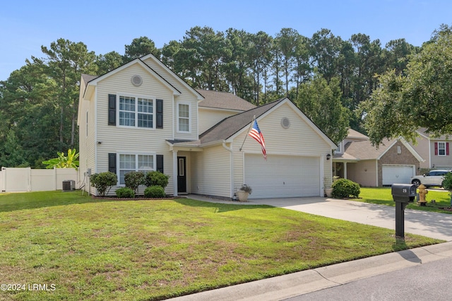 front facade featuring central AC unit, a garage, and a front yard