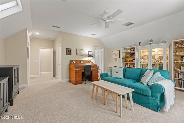 living room featuring light carpet, lofted ceiling, and ceiling fan