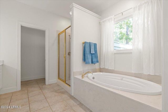 bathroom featuring shower with separate bathtub and tile patterned flooring