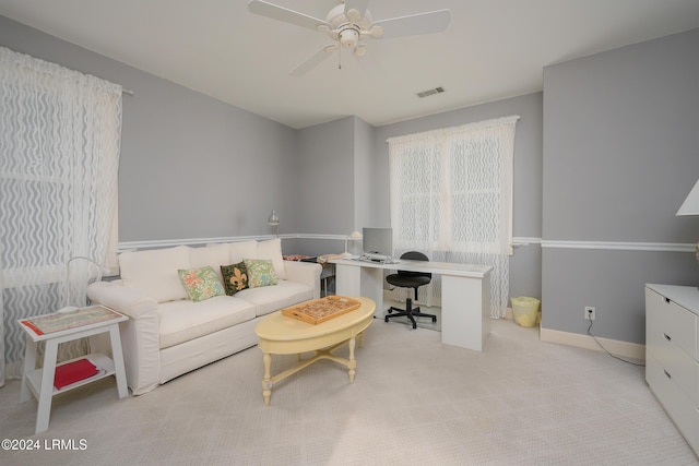 home office with light colored carpet and ceiling fan