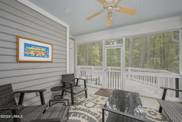 sunroom / solarium with ceiling fan