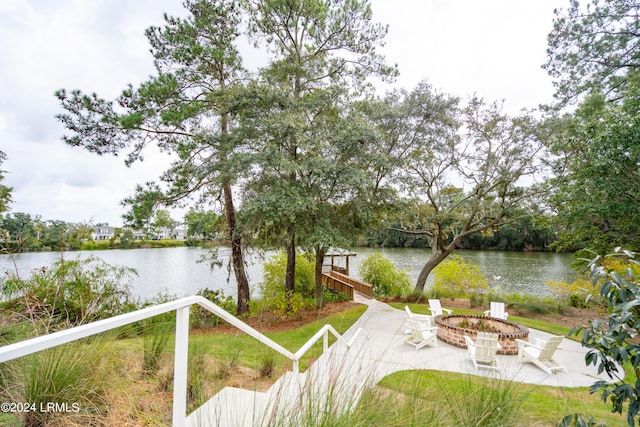 property view of water featuring a fire pit