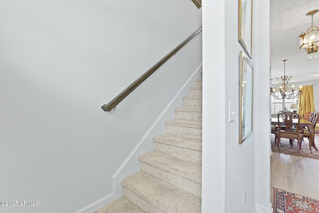 257 Garden Gate Cir E, Hardeeville, SC 29927 - stairs with a chandelier and wood finished floors