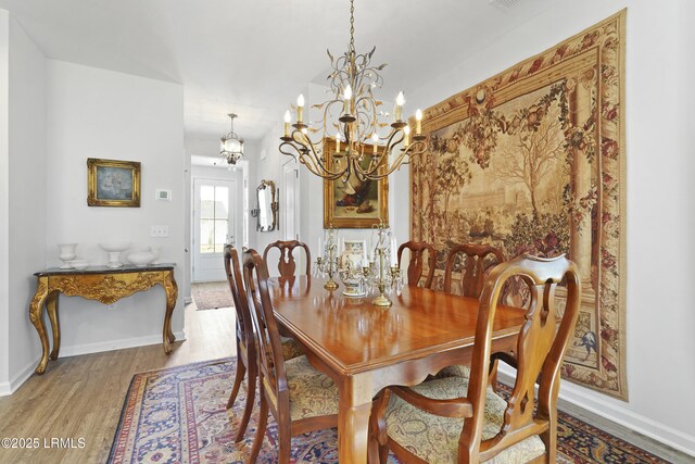 257 Garden Gate Cir E, Hardeeville, SC 29927 - dining space with wood finished floors and a chandelier