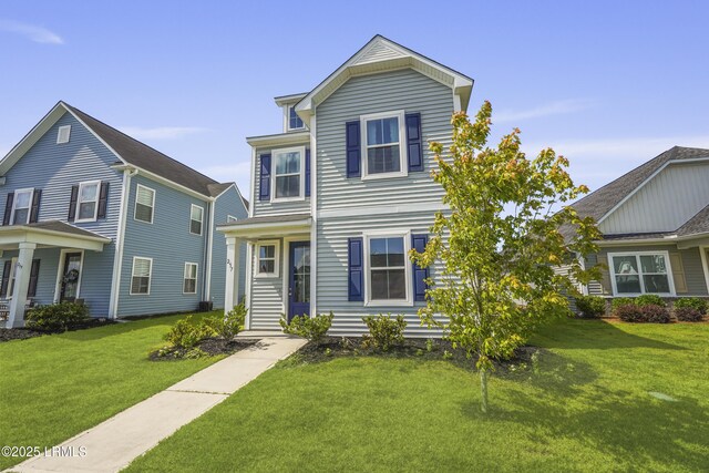 257 Garden Gate Cir E, Hardeeville, SC 29927 - traditional-style home with a front yard