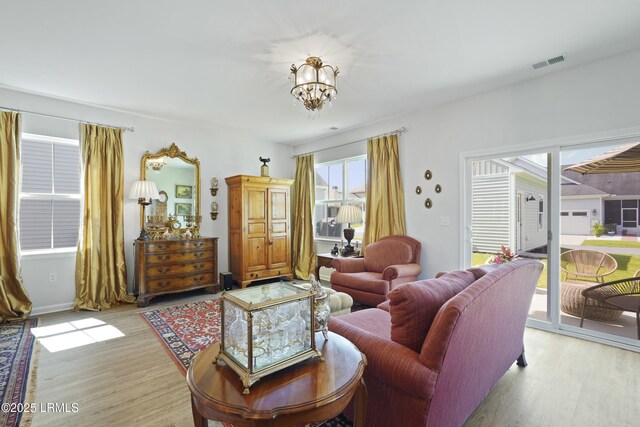 257 Garden Gate Cir E, Hardeeville, SC 29927 - living area featuring light wood finished floors and a chandelier