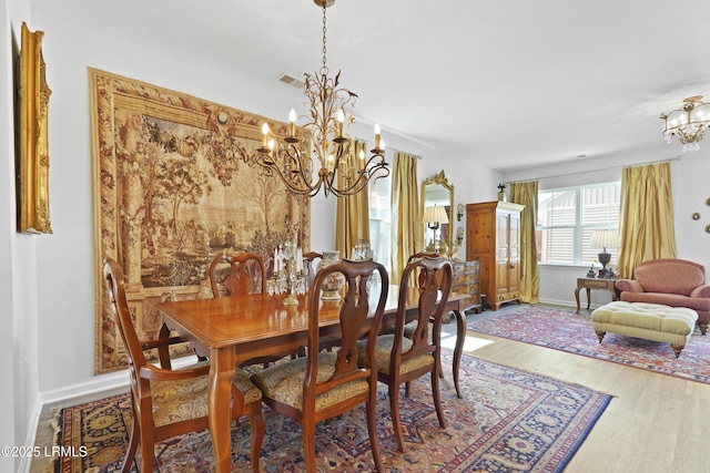 257 Garden Gate Cir E, Hardeeville, SC 29927 - dining room with a chandelier and wood finished floors