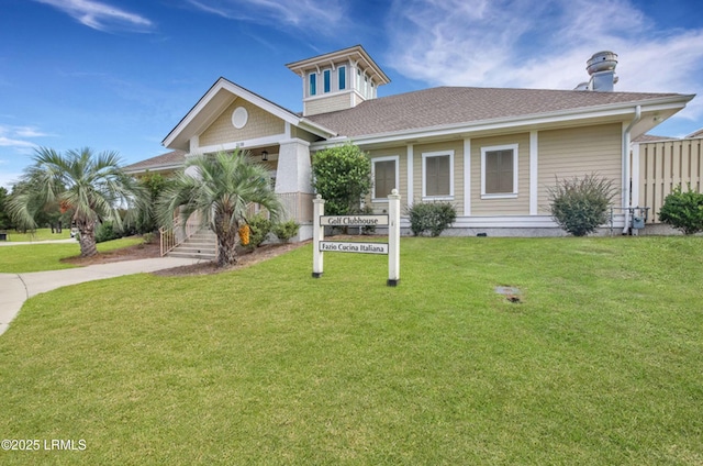 257 Garden Gate Cir E, Hardeeville, SC 29927 - view of front of home with a front lawn, driveway, roof with shingles, and a porch