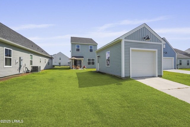257 Garden Gate Cir E, Hardeeville, SC 29927 - view of front of home with board and batten siding, a front yard, driveway, a garage, and an outbuilding