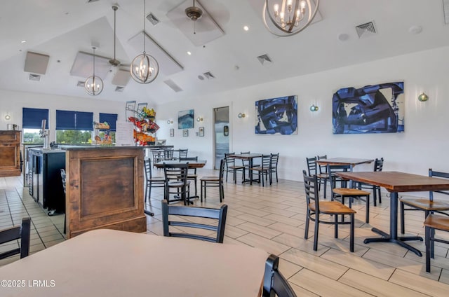 257 Garden Gate Cir E, Hardeeville, SC 29927 - dining room featuring a chandelier, vaulted ceiling, and a ceiling fan