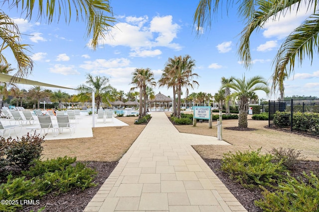 view of property's community featuring fence
