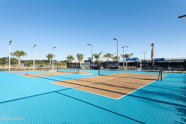 view of sport court with community basketball court and fence