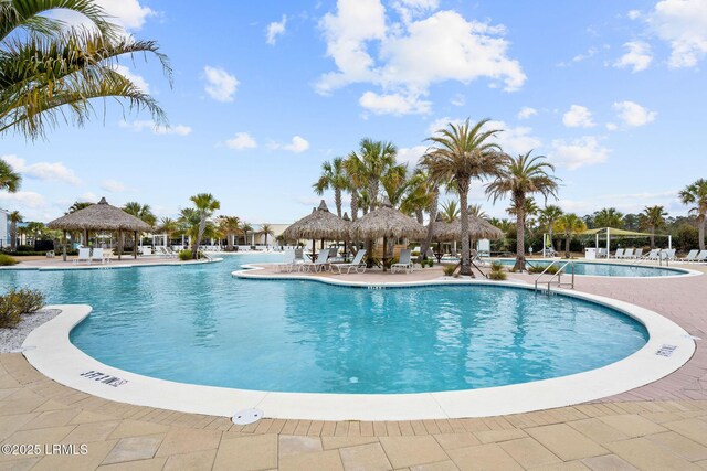 pool featuring a gazebo and a patio