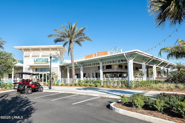 view of property featuring uncovered parking