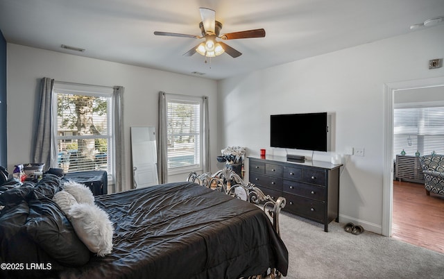 carpeted bedroom with ceiling fan