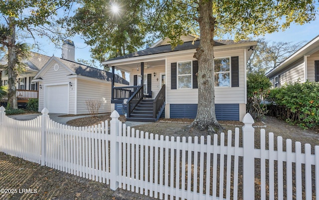 view of front of house with a garage, an outdoor structure, and covered porch