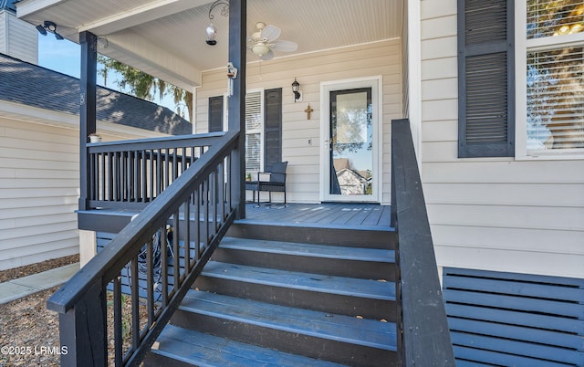 property entrance featuring ceiling fan and a porch