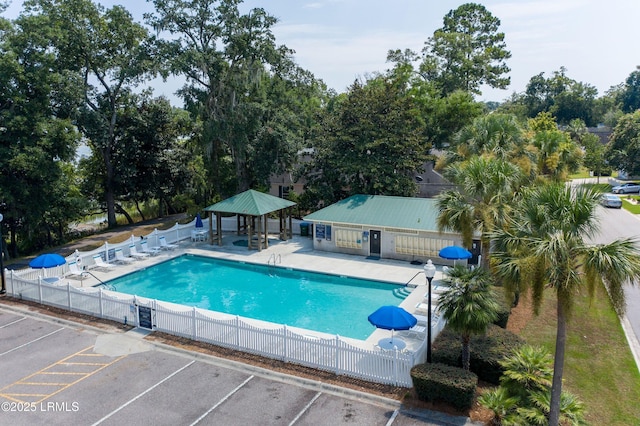 view of swimming pool with a gazebo and a patio