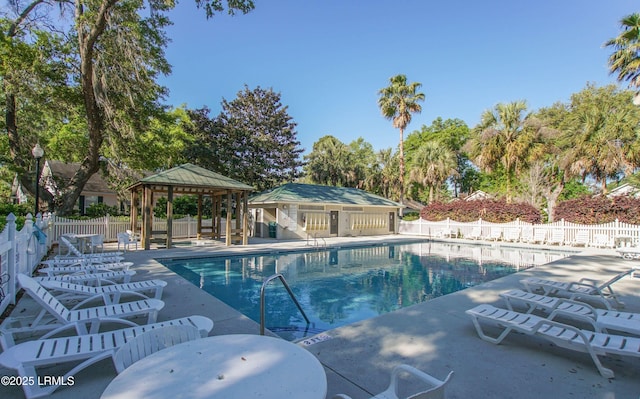 view of swimming pool with a gazebo and a patio area