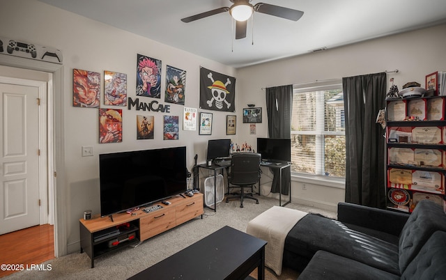 office area with ceiling fan and carpet