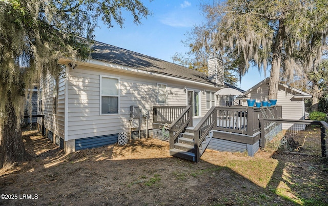 back of property featuring a deck