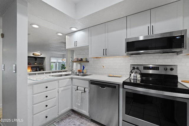 20 Queens Folly Rd Unit 1967, Hilton Head Island, SC 29928 - kitchen featuring stainless steel appliances, a sink, light countertops, white cabinets, and tasteful backsplash
