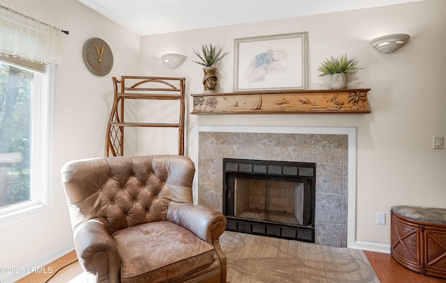 3 Ocean Marsh Ln, Harbor Island, SC 29920 - sitting room featuring a fireplace and wood finished floors
