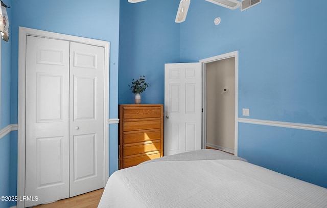 3 Ocean Marsh Ln, Harbor Island, SC 29920 - bedroom featuring a closet, wood finished floors, a towering ceiling, and ceiling fan