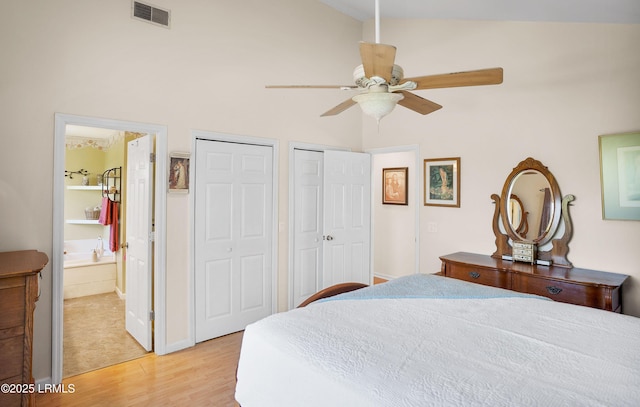3 Ocean Marsh Ln, Harbor Island, SC 29920 - bedroom featuring multiple closets, high vaulted ceiling, light wood-style floors, ensuite bath, and ceiling fan