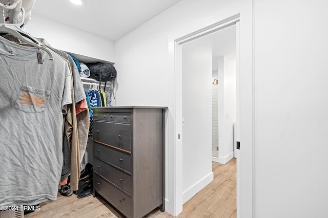 walk in closet featuring light wood-type flooring