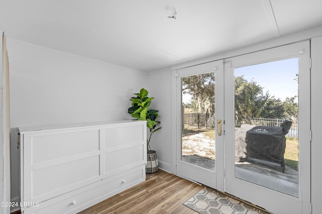 entryway with hardwood / wood-style flooring