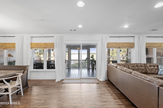 entryway with crown molding and dark hardwood / wood-style floors