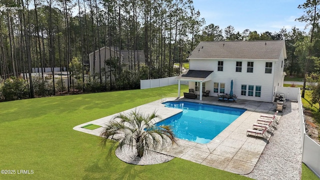 view of swimming pool with a fenced in pool, a fenced backyard, an outdoor hangout area, a patio, and a lawn
