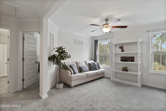 living room featuring carpet, attic access, and plenty of natural light