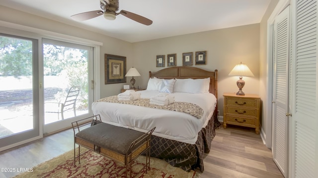 bedroom featuring light hardwood / wood-style flooring, access to outside, a closet, and ceiling fan