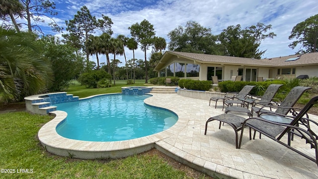 view of swimming pool featuring an in ground hot tub and a patio